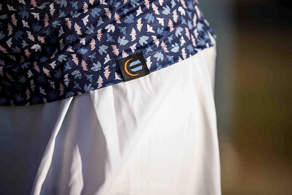 detail shot of logo on womens golf shirt