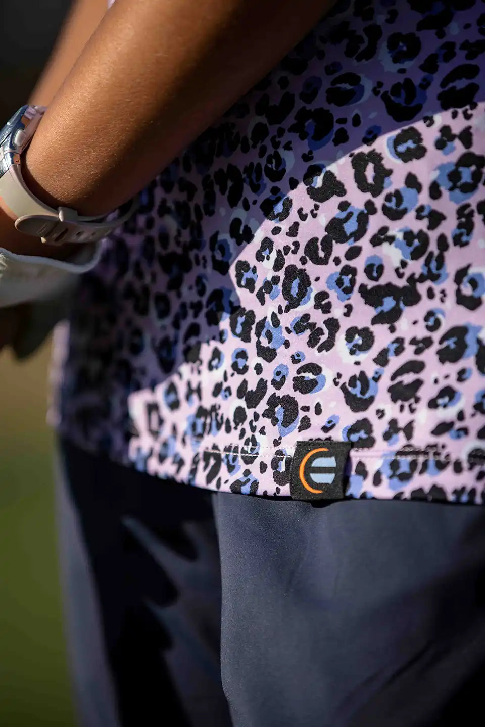 detail shot of womens shirt with logo
