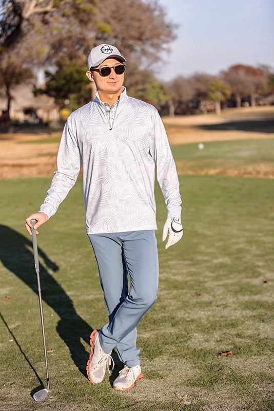 man standing with golf club